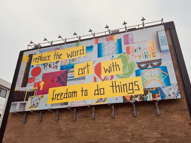 A piece of public art in London, UK, with the words “replace the word art with freedom to do things.”